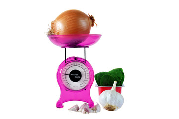 Magenta kitchen scales and vegetables