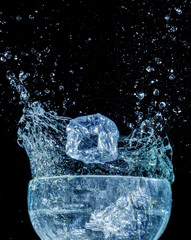 Ice cube blue water wave splash motion