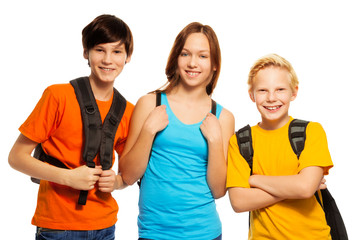 Three kids with school backpacks