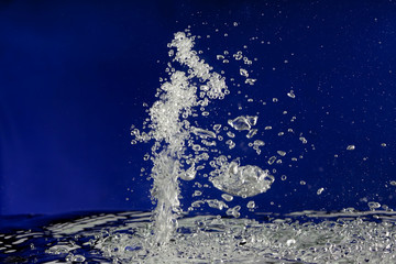 Water splash bubbles abstract background in blue