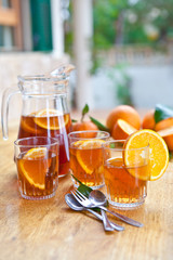Homemade juice / ice tea with fresh oranges