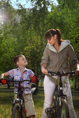 Obraz premium family on bike cycling in park