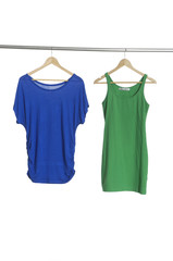 blue and green clothing hanging on hangers