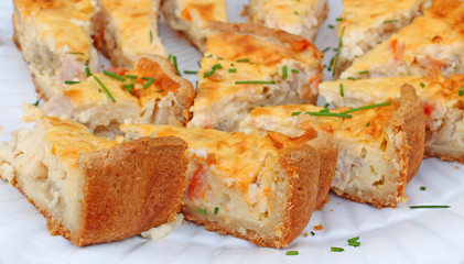 Slices of crusty quiche