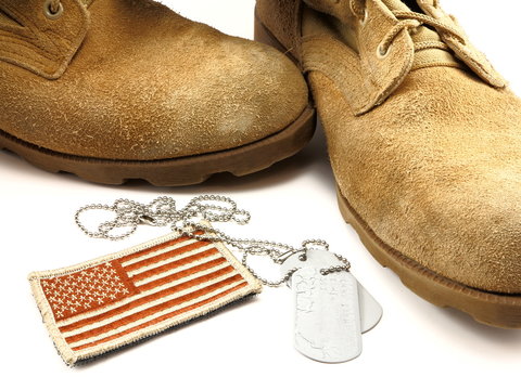 Desert boots, camouflage American Flag patch and dog tags