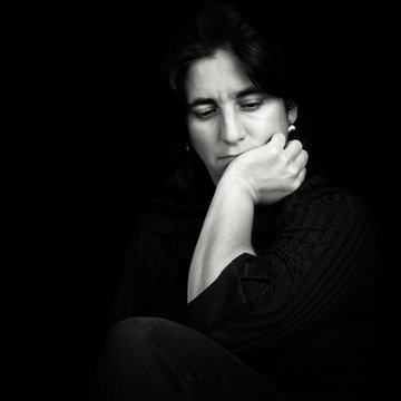 Black and white portrait of a beautiful and sad hispanic woman