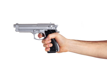 White hand holds gun isolated on white background.