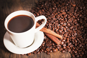 Cup of coffee, coffee beans while.
