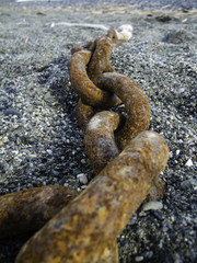Old chain in a beach color image