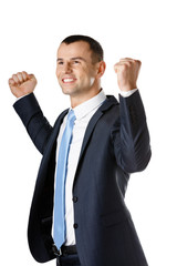 Happy businessman with fists up, isolated on white
