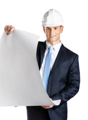 Engineer in hard hat hands blueprint, isolated on white