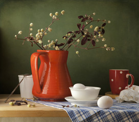 Still life with eggs and red jug