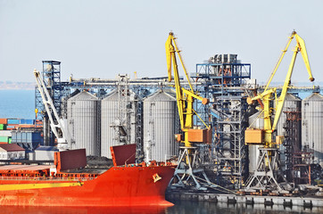 Cargo crane, ship and grain dryer in port Odessa, Ukraine