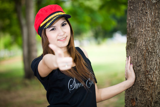 Portrait of young beautiful asian girl showing thumbs up