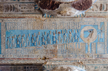 Ancient Egyptian hieroglyphs and carved paintings in Dendera