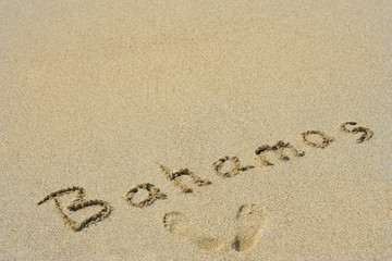 Conceptual handwritten text Bahamas in sand