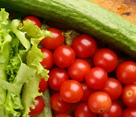red ripe cherry tomatoes on a wooden board