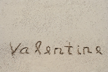 Conceptual handwritten text Valentine in sand