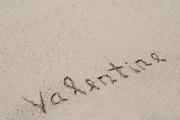 Conceptual handwritten text Valentine in sand