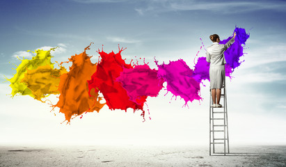 Young woman drawing splashes