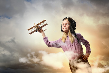Little girl in pilot's hat