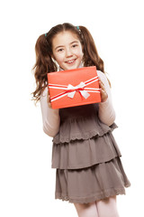 happy, beautiful little girl in a dress with a presents