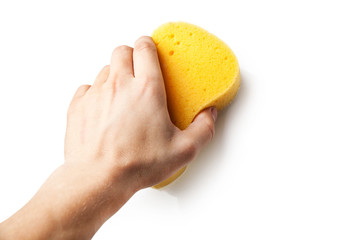 Hand holding a sponge isolated on white background.