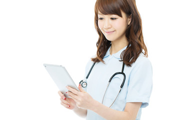 Beautiful young nurse on white background