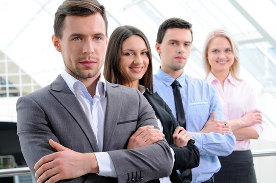 Group Of Business People Smiling In An Office Lined Up