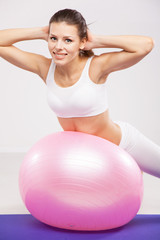 Fototapeta na wymiar Woman on a fitness ball