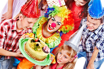 Birthday party group of child with cake.