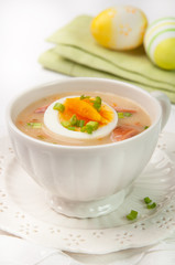 White borscht with eggs and white sausage.Polish easter soup