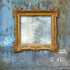 Gold baroque frame on a grunge wall