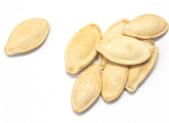 Obraz premium pumpkin seeds on a white background. macro