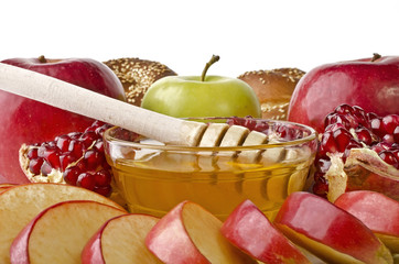 Still life closeup - challah, apples, pomegranate and honey