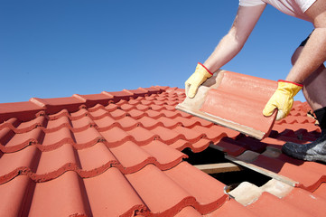 Fototapeta Construction worker tile roofing repair obraz