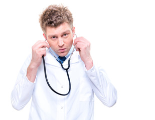 cherfull doctor listening with a stethoscope. Isolated
