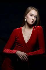 Naklejka premium Pretty young woman portrait in red dress