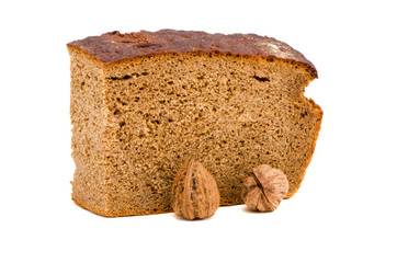 ecological brown bread and walnuts isolated on white