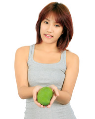 Isolated young asian woman with a mango over white.