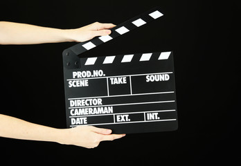 Movie production clapper board isolated on black
