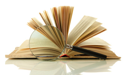 Magnifying glass and open book isolated on white