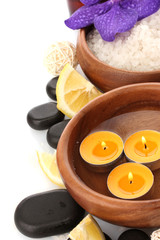 Beautiful spa setting with flower and orange, isolated on white