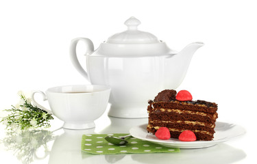 Teapot, cup of tea and delicious cake isolated on white