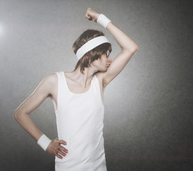 Retro macho nerd kissing his biceps isolated on gray background