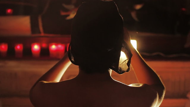 Man in veil in religious ritual