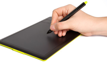 isolated mans hand draws a pen on a tablet