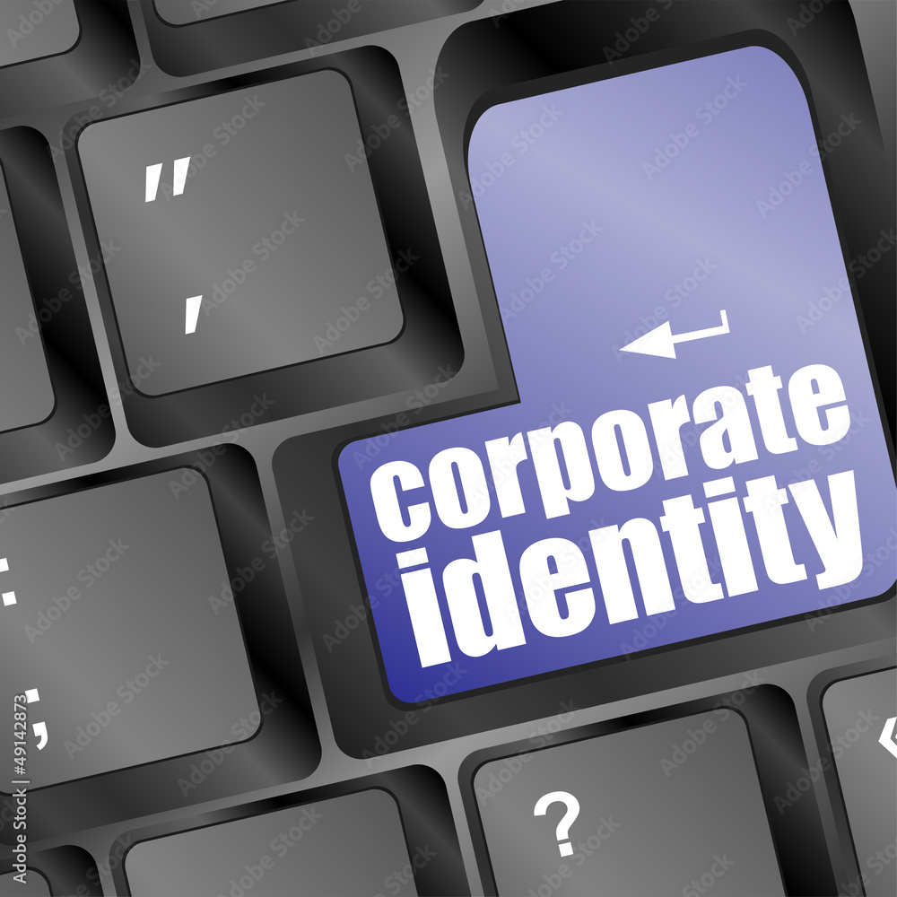 Poster wording corporate identity on computer keyboard