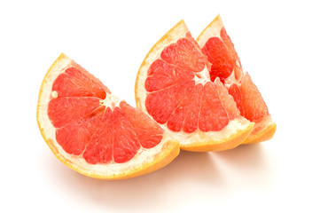 Fototapeta na wymiar Slices of grapefruit isolated on white