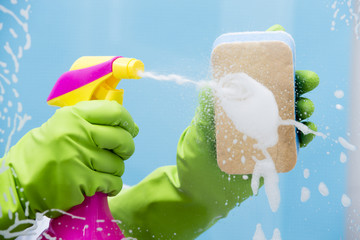 Cleaning - cleaning window pane with spray detergent